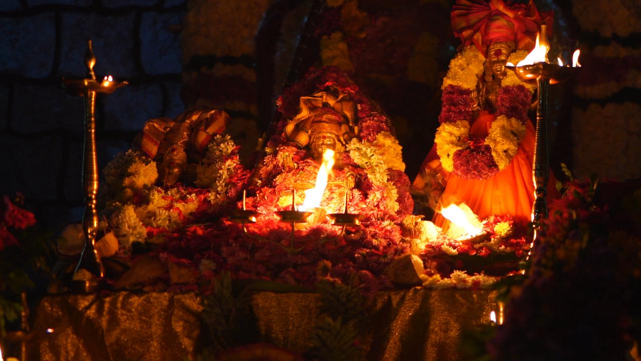 Sacred Evening Temple Ceremony with Oil Lamps and Marigold Garlands